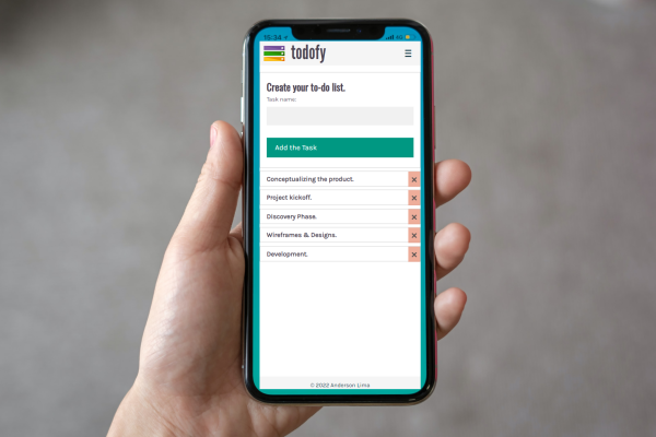 Photo of a mobile phone showing the Todofy app on the screen.